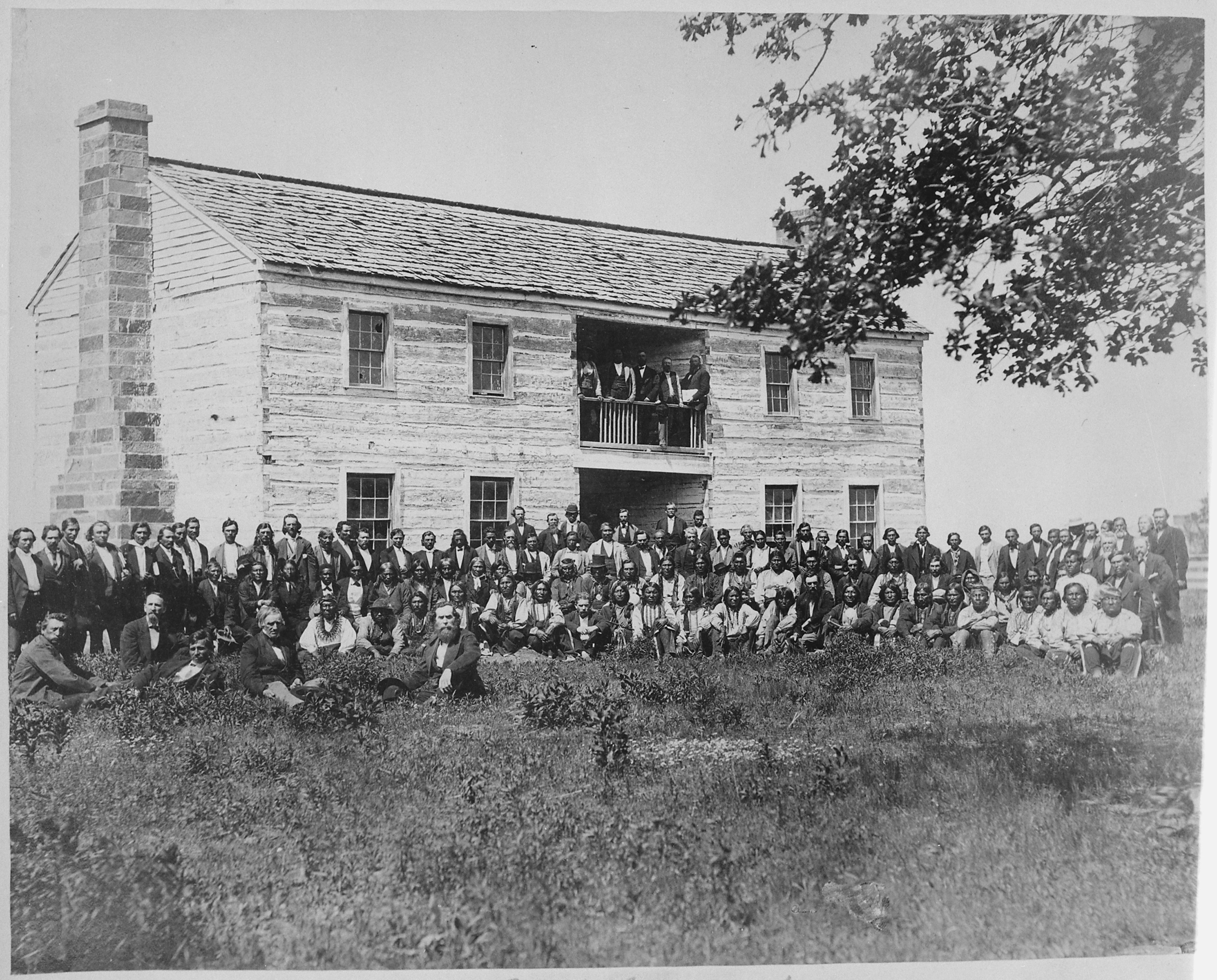 A black and white photograph of the delegates from 34 tribes in front of Creek Council House.