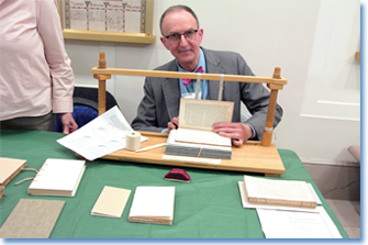 A NARA specialist in book preservation demonstrates some of the tools of the trade for the public at the recent Preservation EXPOsed! event.