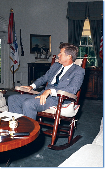 JFK in his rocking chair. Photograph by Robert Knudsen, from the John F. Kennedy Presidential Library and Museum, Boston (orig. date: 08/15/1963).