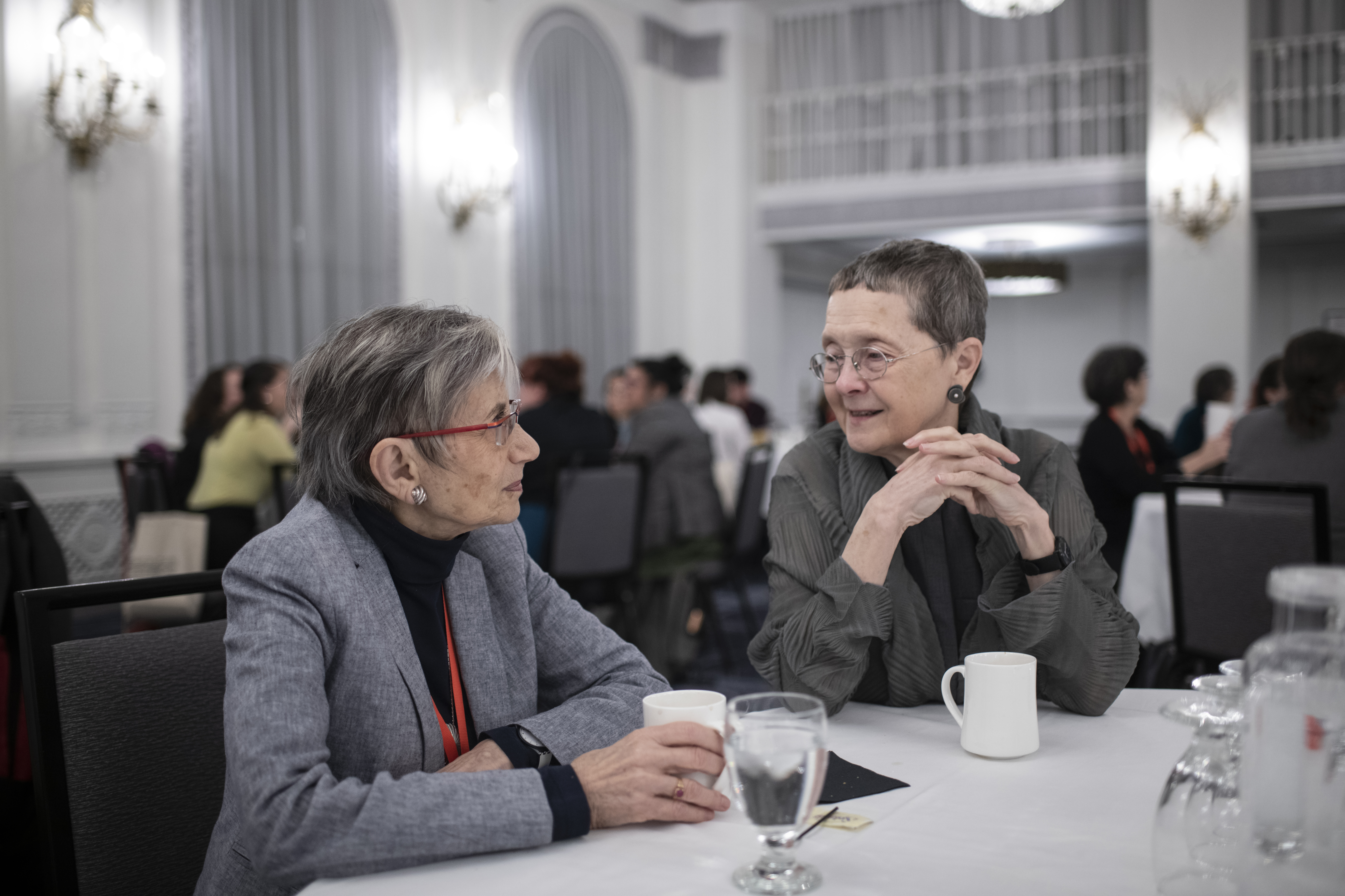 AHA president Mary Lindemann (right) speaks with Renate Bridenthal at the 2019 AHA Committee on Gender Equity breakfast.