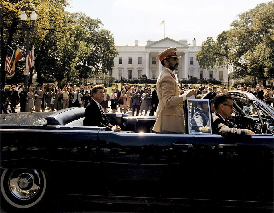  Ethiopian Emperor Haile Selassie and President John F. Kennedy greet a crowd of Black and white people outside the White House during Selassie’s state visit in 1963.