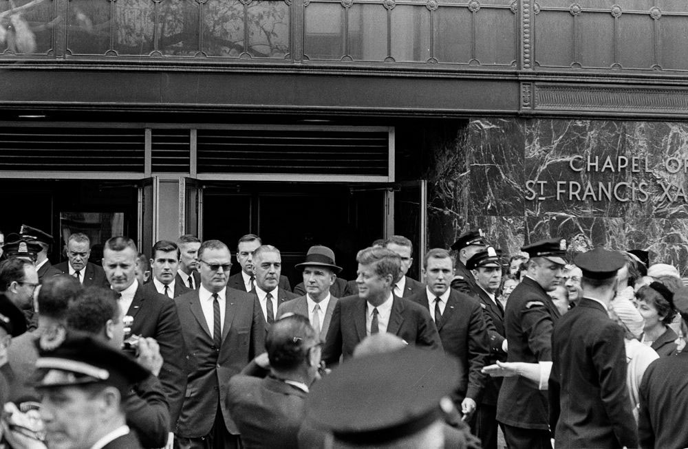President John F. Kennedy exits St. Francis Xavier Chapel in Boston, Massachusetts, after attending Mass in 1963.