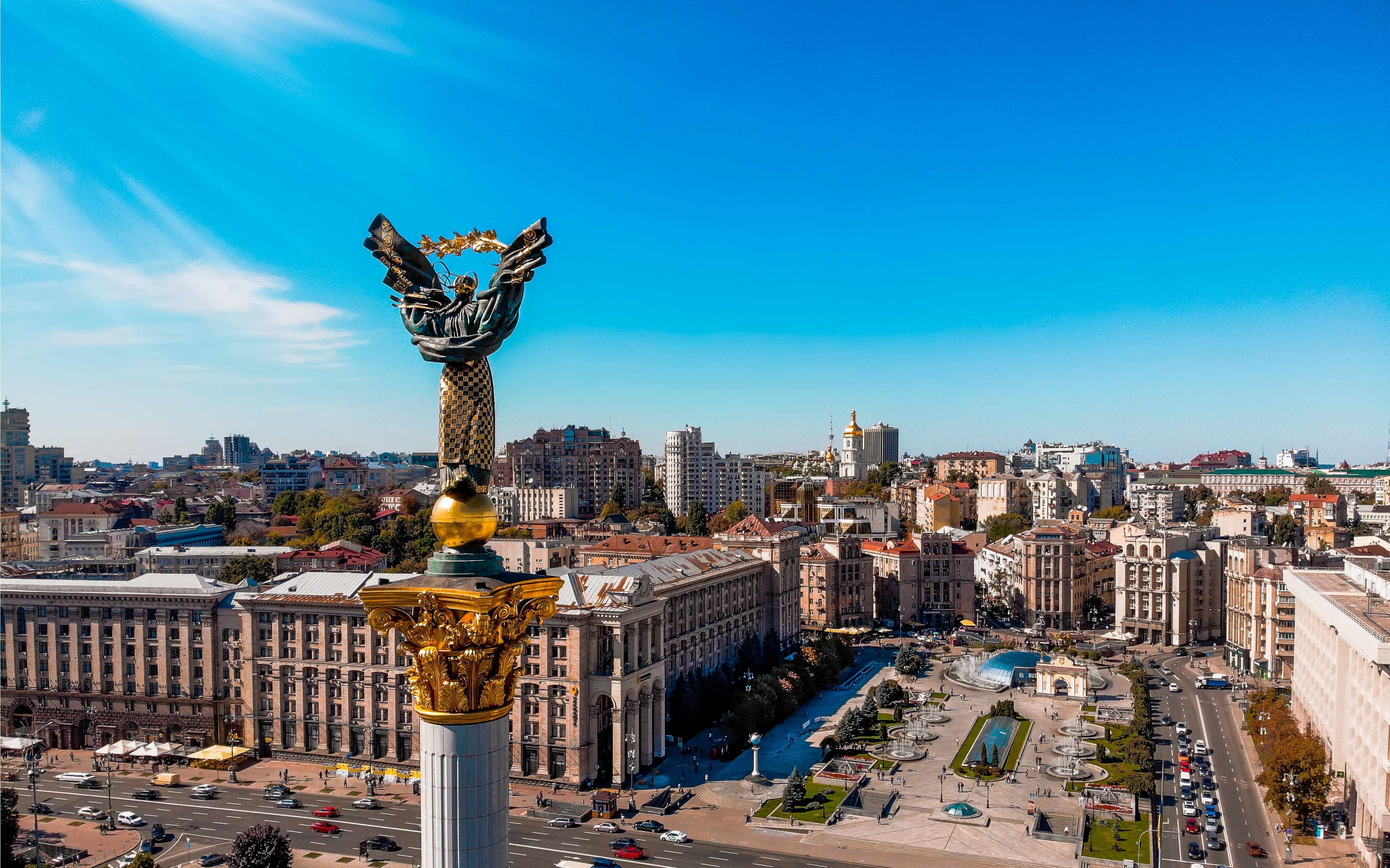 The Independence monument overlooking the city of Kyiv, a column with a figurine of a woman with a rose branch in her arms.