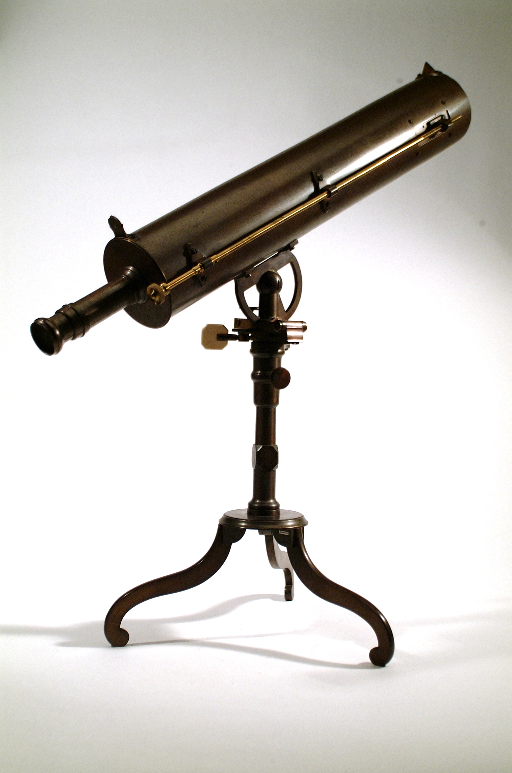 Photo of brass telescope angled upwards to the right