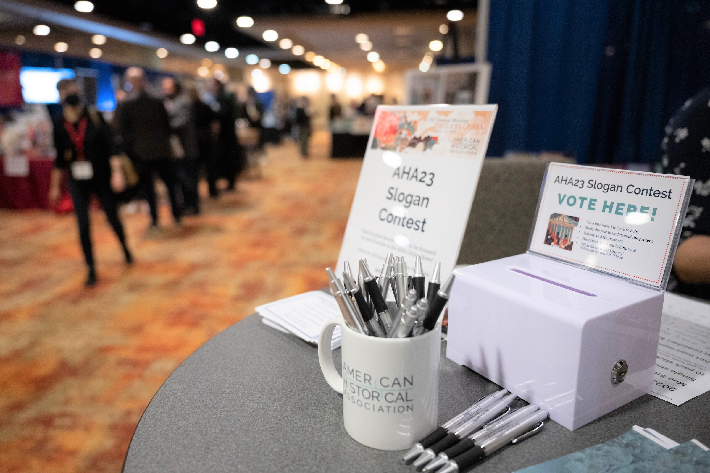 A photo of a table at AHA23 with a sign saying 