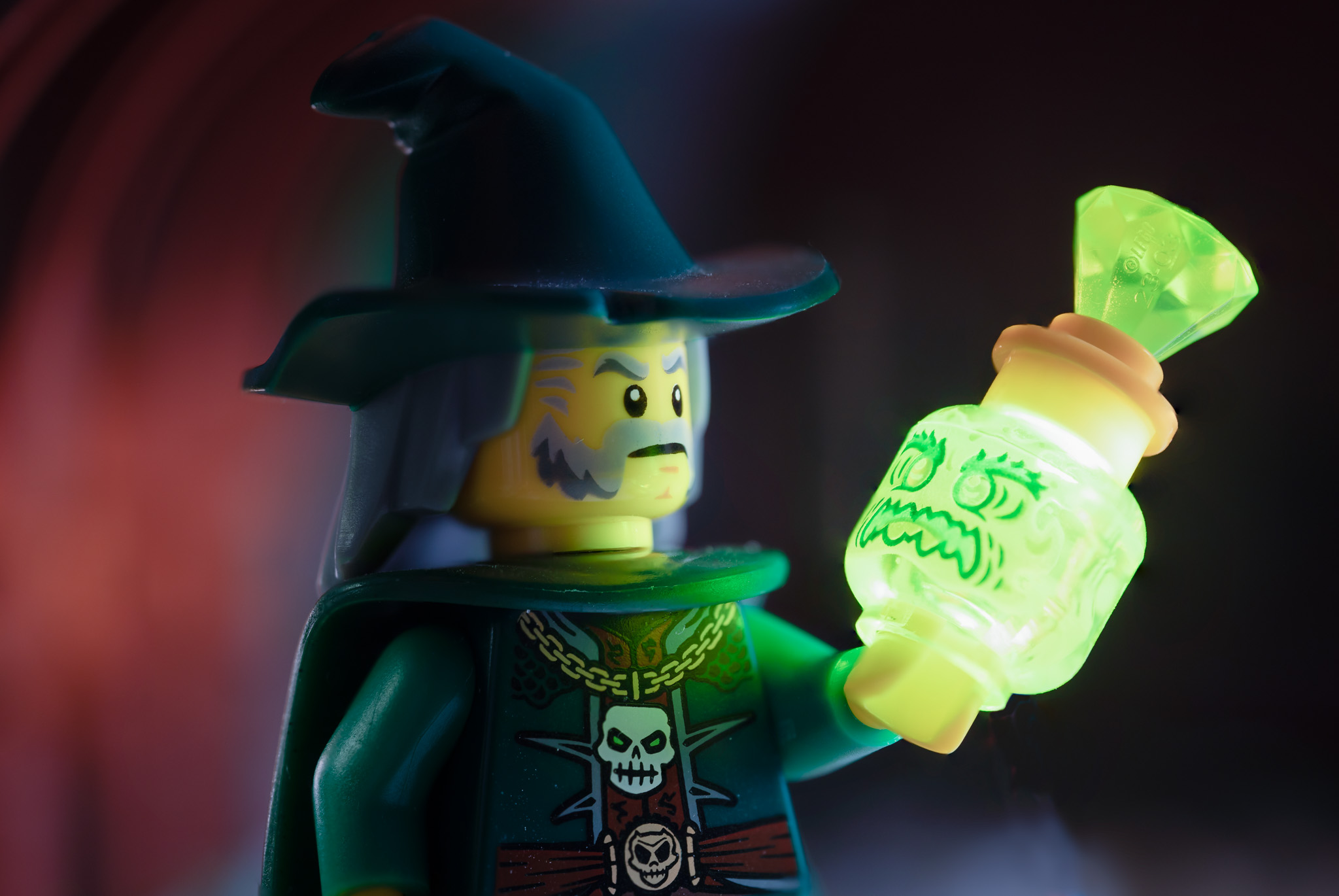 A Lego figure in medieval dress, holding a glowing Lego head.