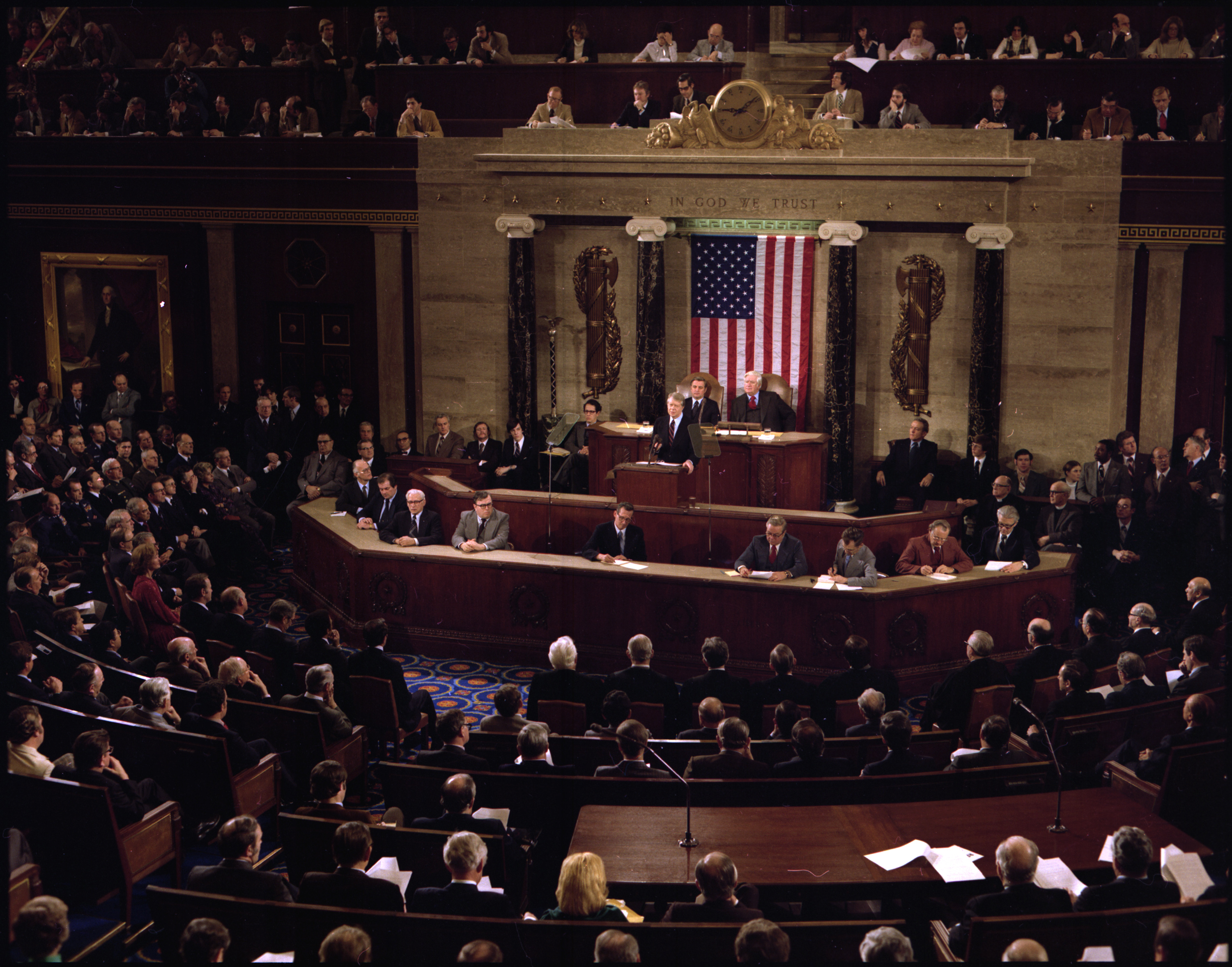 Former US President Jimmy Carter stands at the speaker’s podium in front of an American flag to deliver his 1978 State of the Union address to both chambers of Congress.