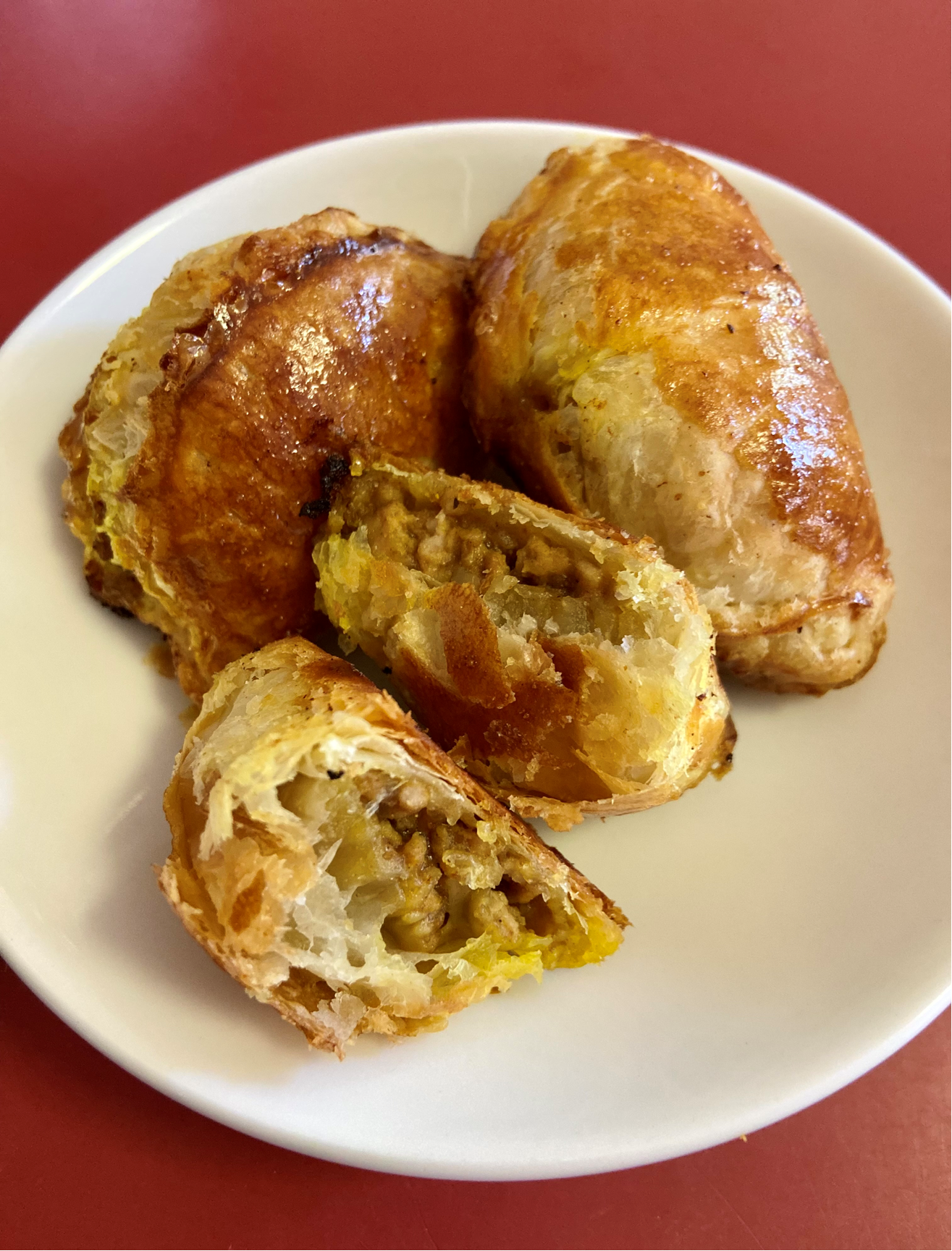 A plate of curry puff pastries.