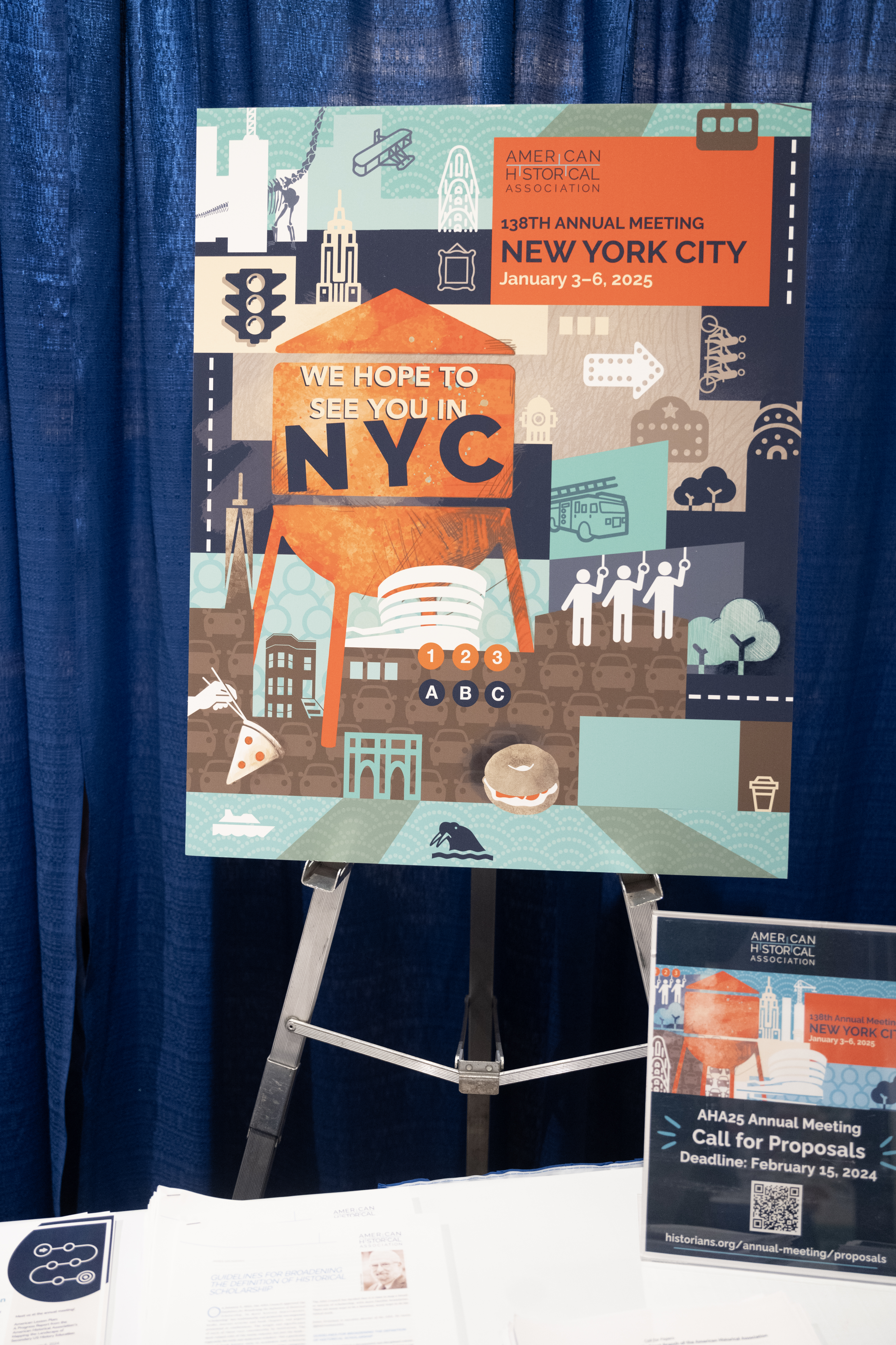 A poster that says ‘we hope to see you in NYC’ with the AHA25 logo 
