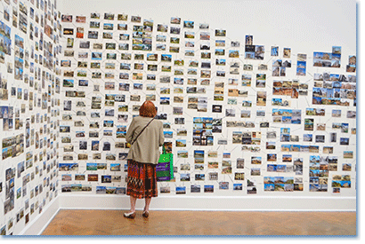 Ellen Harvey, Pillar-Builder Archive (installation view), 2013. Approximately 3,000 postcards, acrylic paint, and tape, dimensions variable. Photo courtesy Corcoran Gallery of Art.