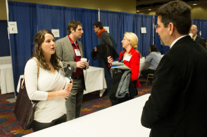 Rob Townsend of the American Academy of Arts and Sciences speaks with interested job seekers at the Career Fair.