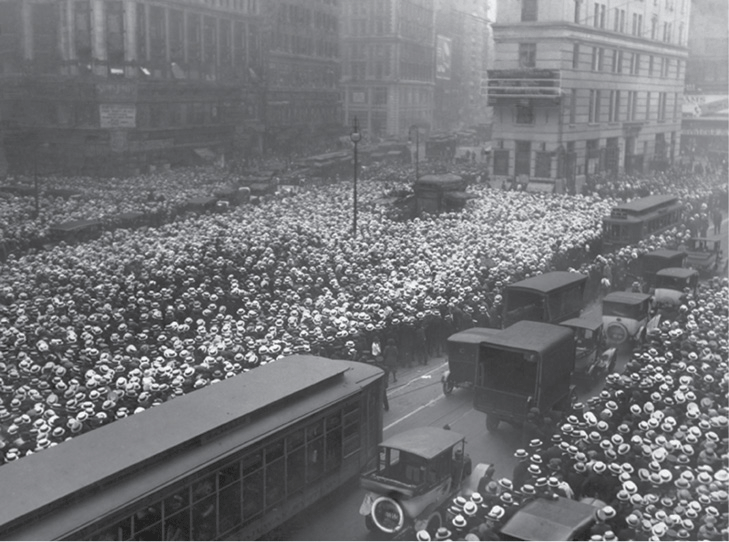 New York Times Photo Archives.<p> A crowd gathers on Times Square for updates on the Jack Dempsey-Georges Carpentier fight in 1921.