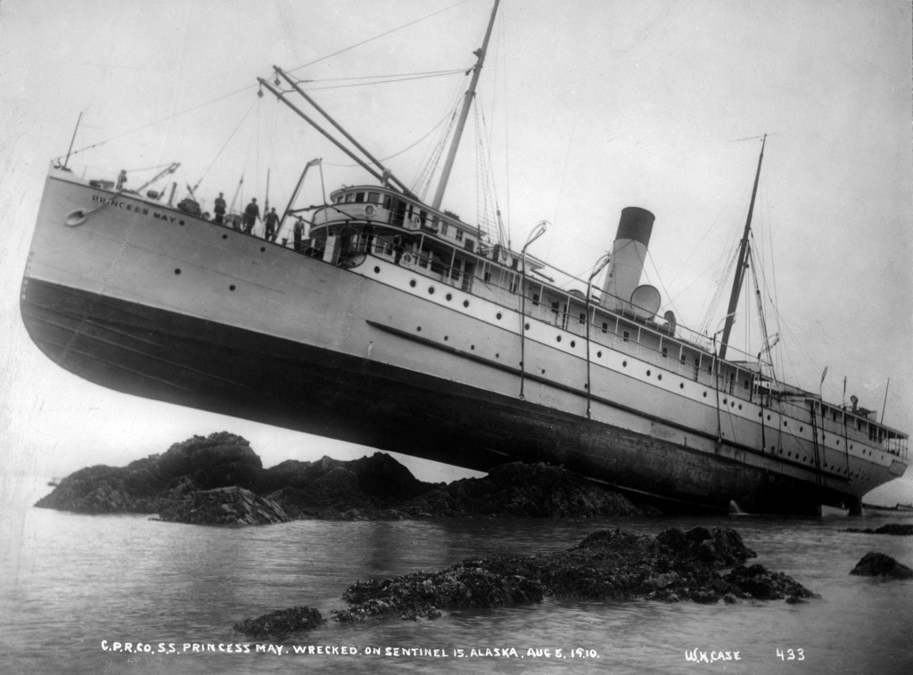 The SS Princess May, a ship that has run onto large rocks
