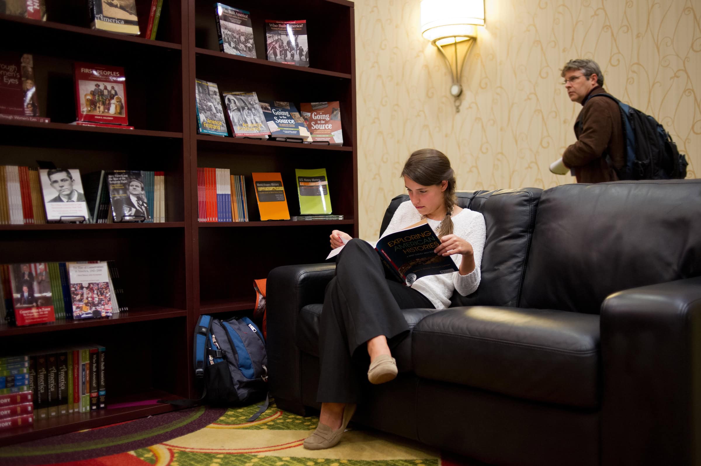 Woman reading at a library Woman reading at a library
