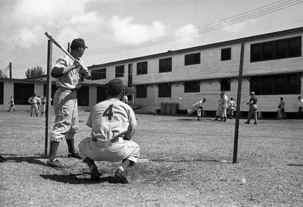 A batter and catcher await a pitch.