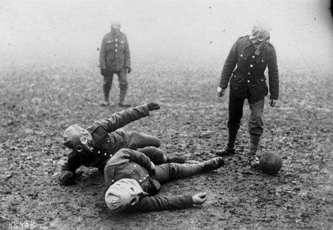 Tommies play football with a gas masks