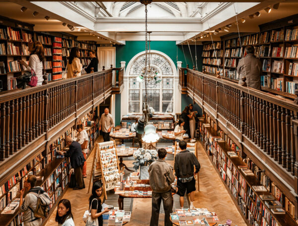 View of a two-story bookstore from the balcony.