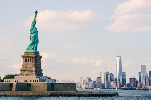 View of the Statue of Liberty with the many skyscrapers of New York City in the background