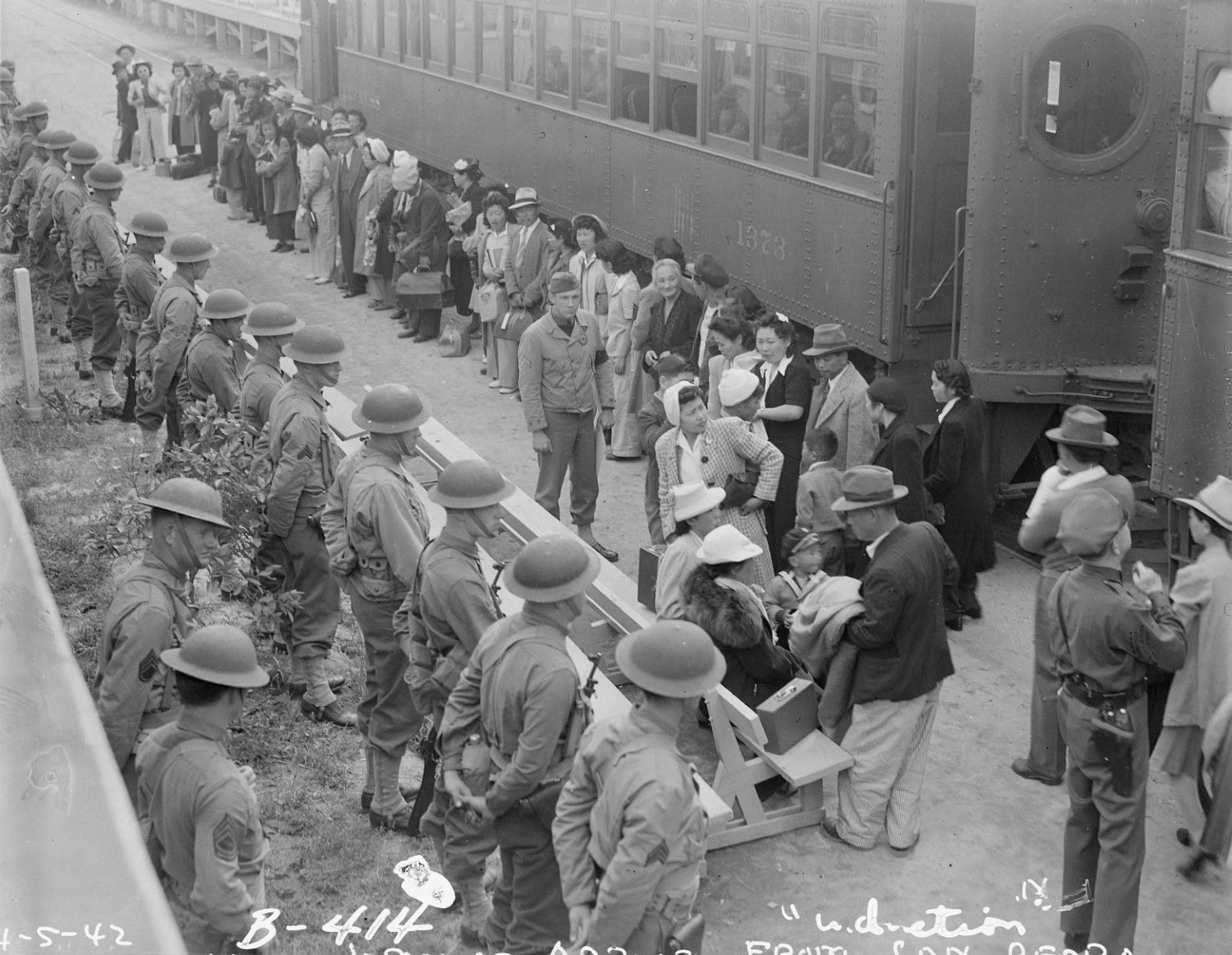 An historical photo of Japanese Americans arriving at the Santa Anita (California) Assembly Center before being moved inland to an internment camp.