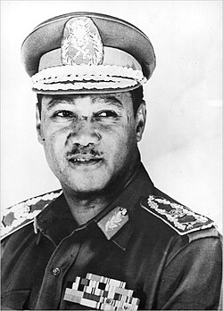 Black and white headshot. Nimeiri is looking to the side of the camera, wearing a dress military uniform and peaked cap.
