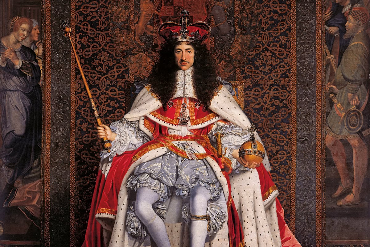 Painting of Charles II. He is sitting on a throne wearing a dramatic cape and crown. A large tapestry can be seen behind him.